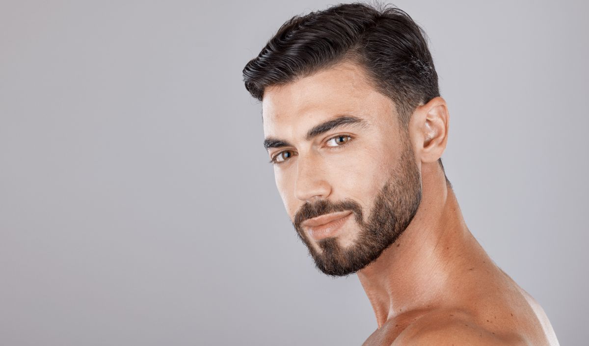 Face of a handsome man after dermal filler treatment
