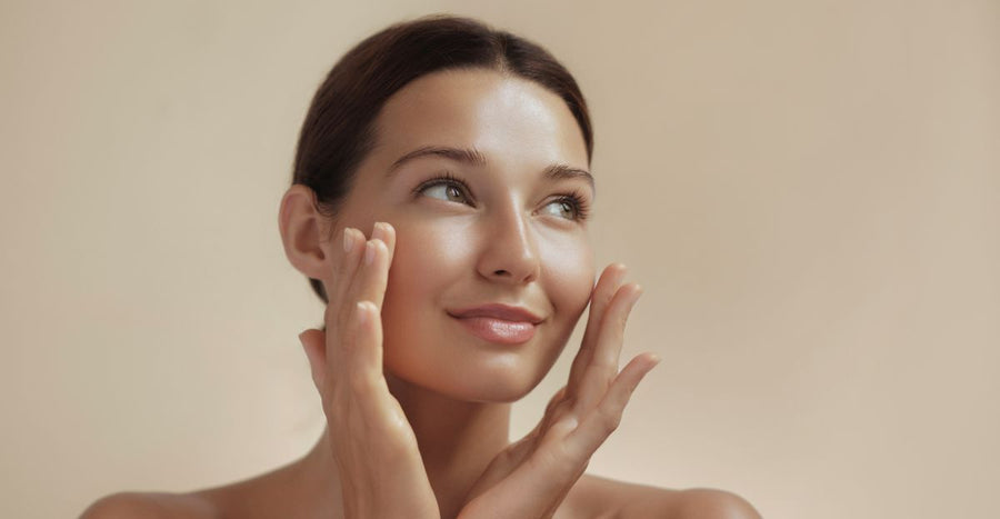 woman after facial laser skin therapy touching her smooth glowing skin 