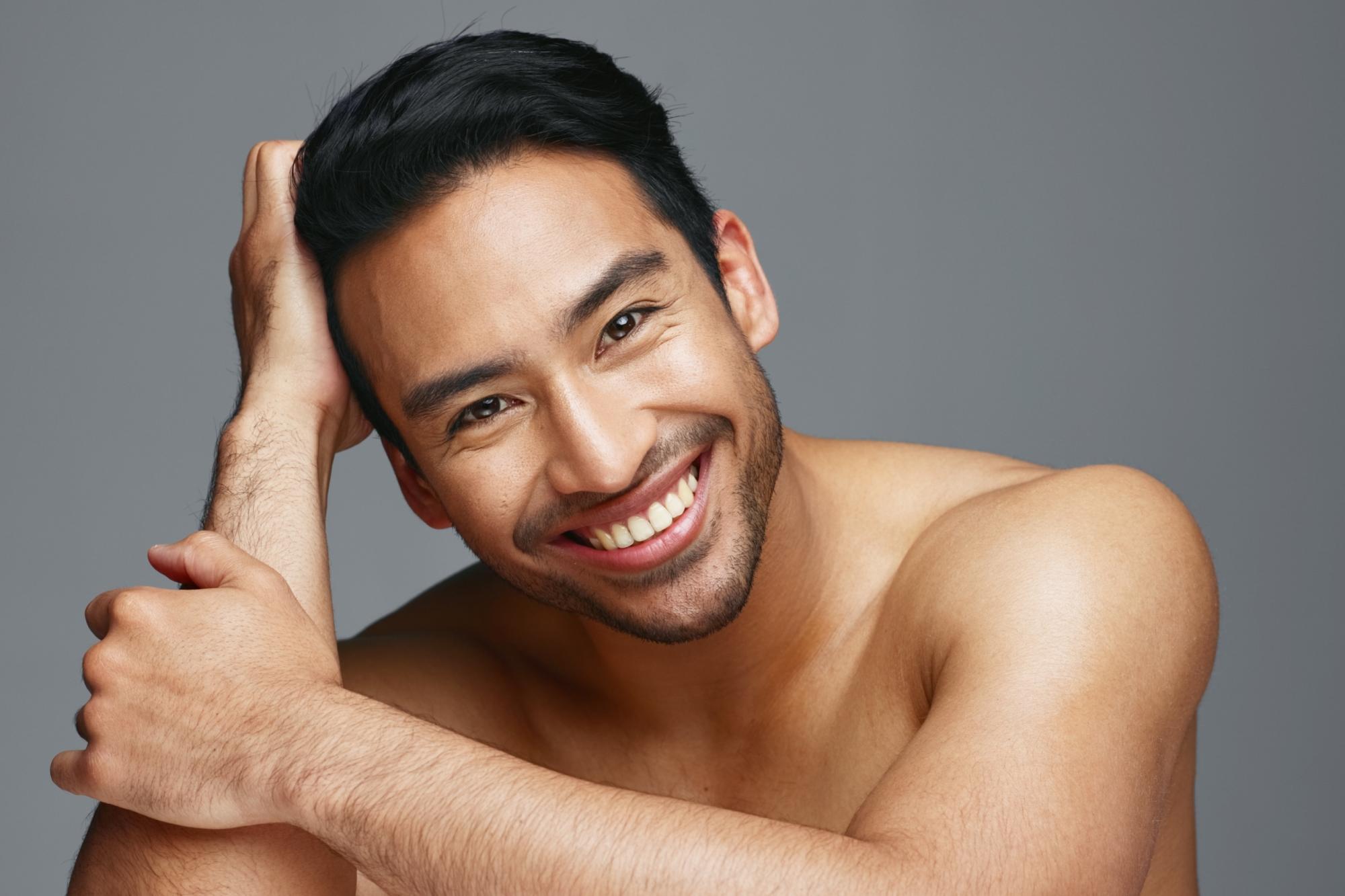 Face, cosmetics and Asian man with skincare, smile and dermatology | AviClear® for Skin Rejuvenation in Los Angeles and West Hollywood
